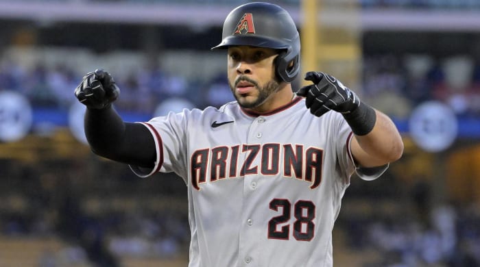 Diamondbacks outfielder Tommy Pham signals to the dugout during a game vs. the Dodgers.